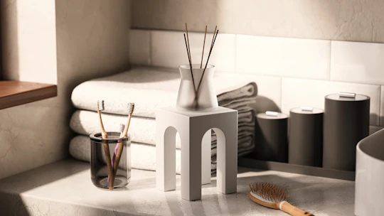 Close-up of folded bathroom towels and detailed décor elements, created by Kutuko Studio using Redshift.